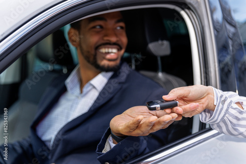 Businessman happy to receive new car keys