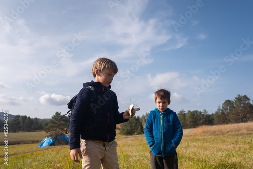 Boys examine the mushroom