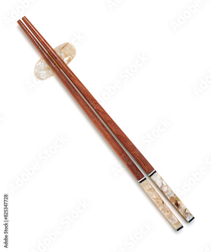 Reusable wooden chopsticks on chopstick rest