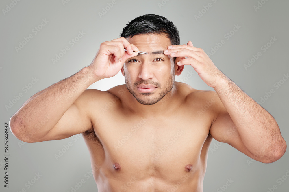 Morning, eyebrow and man with tweezers, portrait and hair removal for routine in studio and plucking. White background, grooming and tools for shaping, styling and person with face in bathroom Morning, eyebrow and man with tweezers, portrait and hair removal for routine in studio and plucking. White background, grooming and tools for shaping, styling and person with face in bathroom