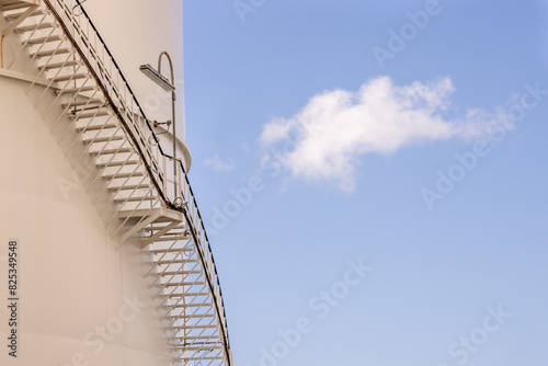 Stairs on the side of a gas storage tank.