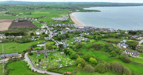 Ireland Epic locations drone panorama of Ardmore Round Tower and cathedral looking to Ardmore Village and Beach in Waterford photo