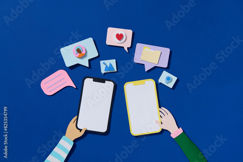 Paper cut style smartphone with chatting bubble on social media photo