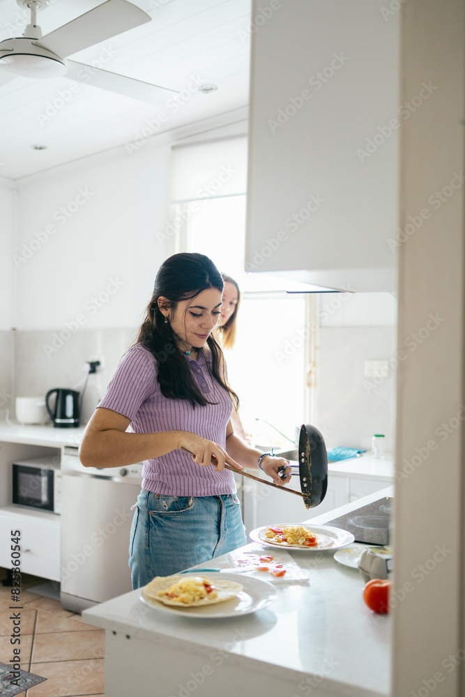 Young woman living in a Queenslander house in Australia Young woman living in a Queenslander house in Australia