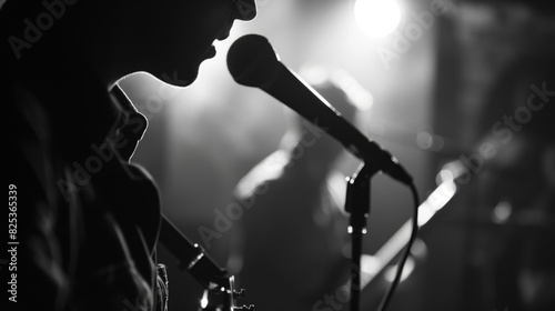 A moody black and white image of the band performing a slower more melancholic track from the album. photo