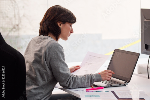 Diligent Office Worker using laptop