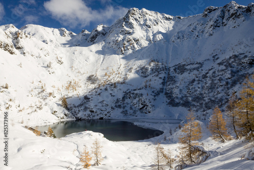 Scenic winter landscape with Erdemolo Lake. Lagorai Mountains, Italy photo