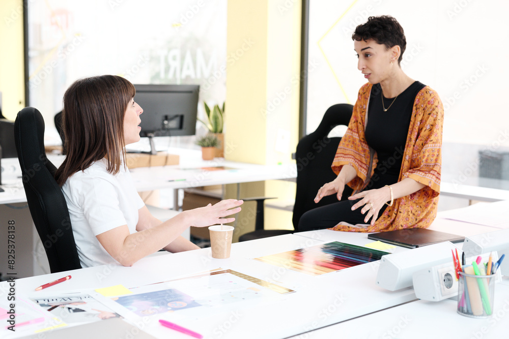 Engaged Businesswomen Discussing Engaged Businesswomen Discussing
