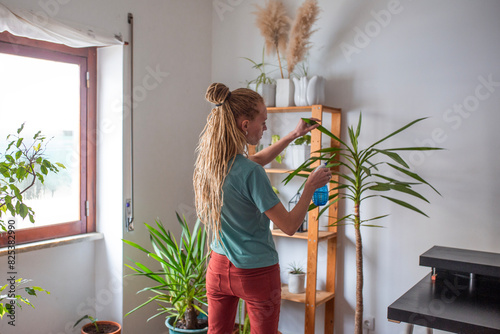 europenian woman take care about home plants photo