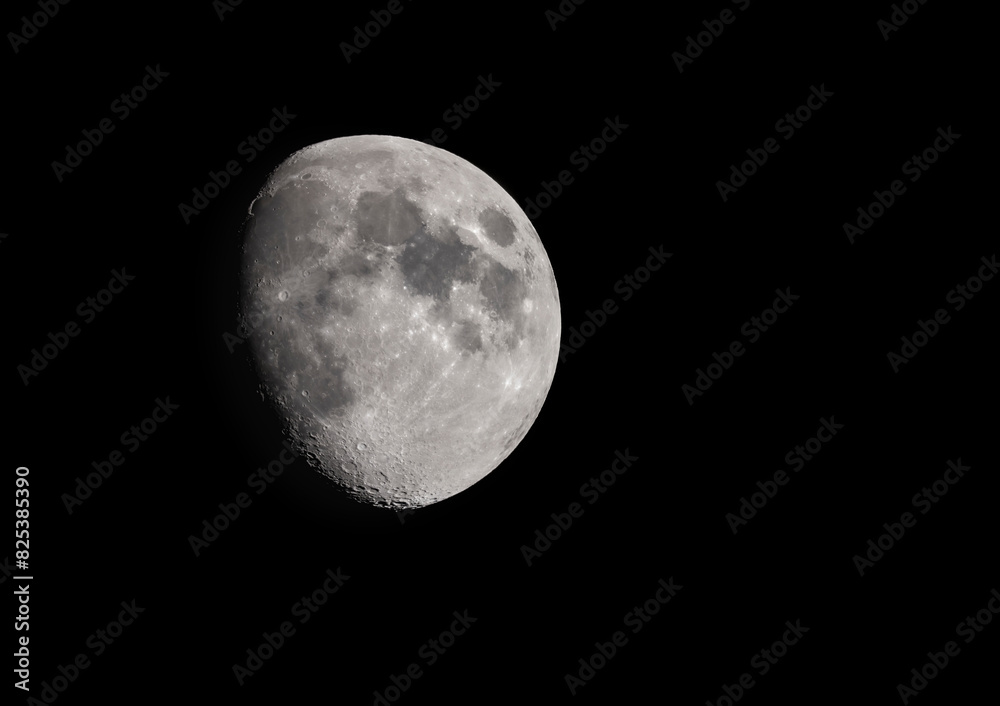 A three quarter moon in a clear sky A three quarter moon in a clear sky