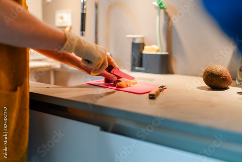 Senior Female Preparing Food with Bandaged Hand photo