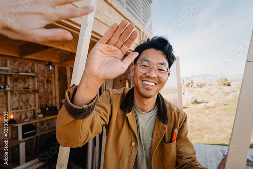 high-five, happy accomplished person photo