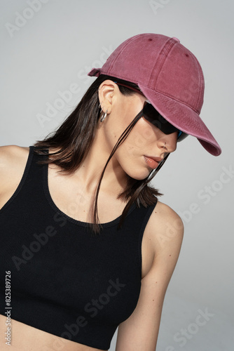 Woman wearing a pink/red baseball cap