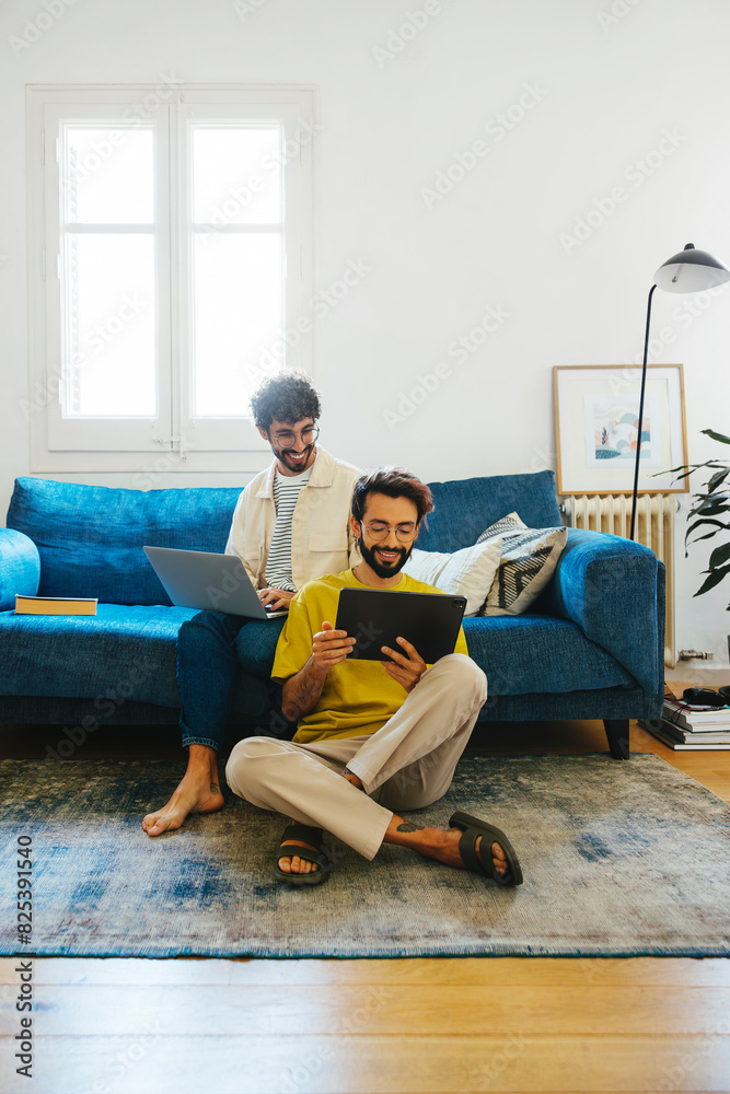 Smiling gay couple using devices at home Smiling gay couple using devices at home