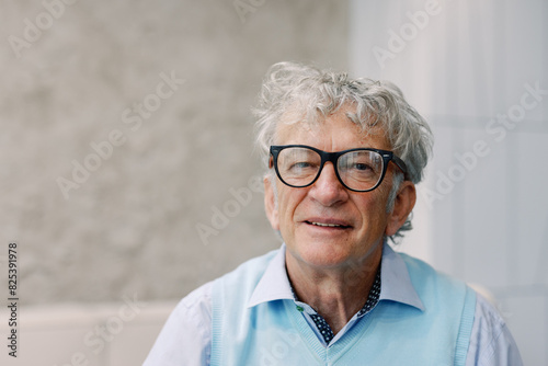 Portrait of Smiling Senior Man with Glasses photo