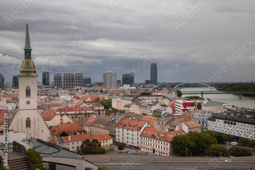 Aerial view of Bratislava cityscape under dramatic clouds