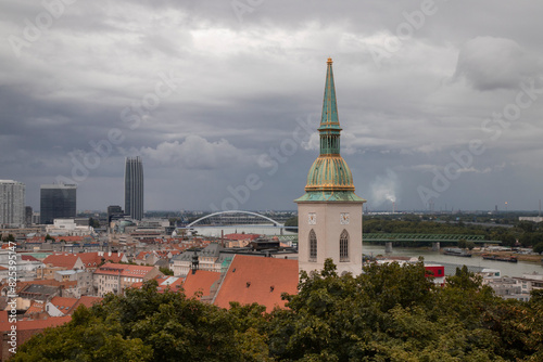 Photography Aerial view of Bratislava cityscape under dramatic clouds