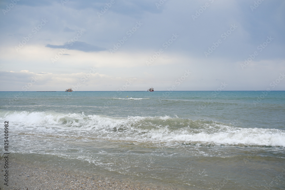 Mediterranean seaside coast with two shios in stormy weather in one evening. Mediterranean seaside coast with two shios in stormy weather in one evening.