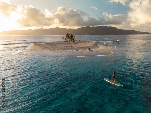 Woman at Remote Caribbean Island with Stand Up Paddle Boards