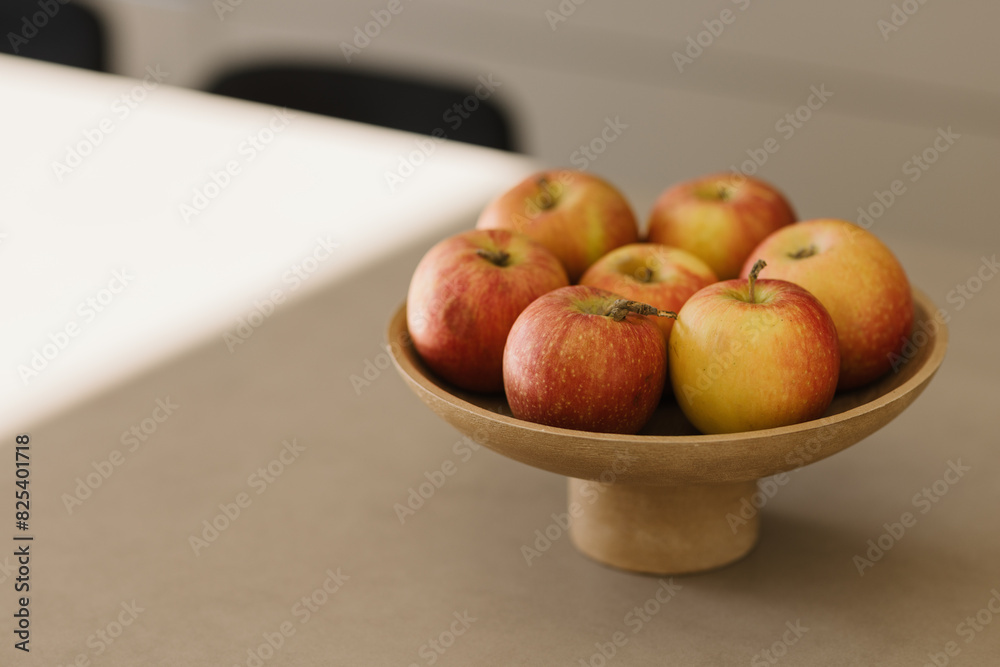 Basket with fresh fruits on table in kitchen Basket with fresh fruits on table in kitchen