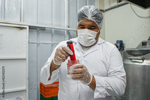 Food Industry Plus Size Worker Using Technology photo