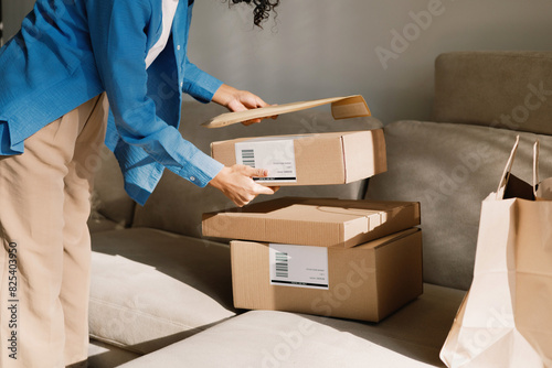 Close-up Woman Unpacking Package at home Online Shopping