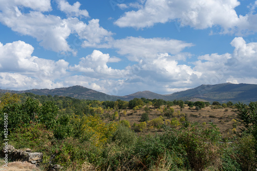 Typical Castilian inland landscape with mountains and flat areas under a bright sky