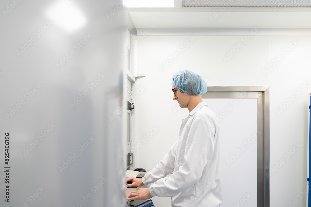 Scientist Working In Clean Room Scientist Working In Clean Room