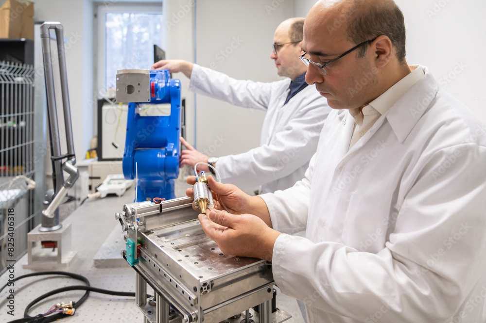 Scientists Working At Robotics Laboratory Room Scientists Working At Robotics Laboratory Room