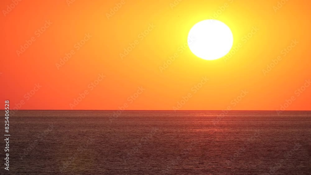 Epic sunset scenery on the ocean with yellow-orange sky for wallpaper Epic sunset scenery on the ocean with yellow-orange sky for wallpaper