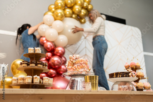 Setting up party decoration.