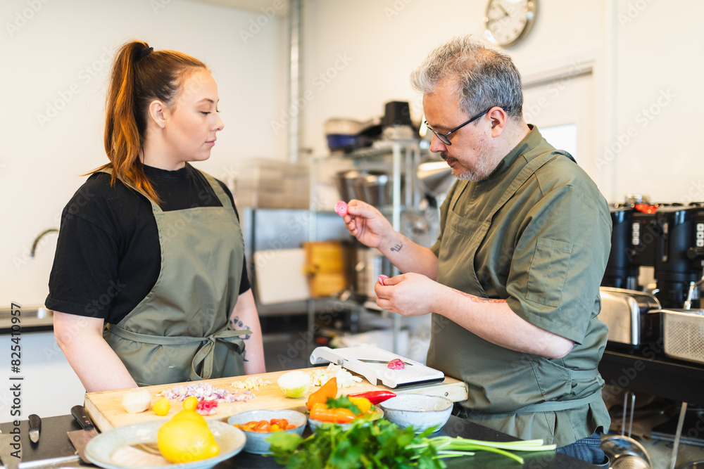 Two chef during preparation process Two chef during preparation process