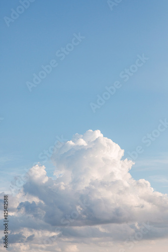 big, puffy white cloud in blue sky