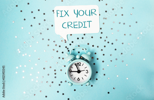 A clock with the words Fix Your Credit written above it photo