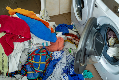 Heap of second hand laundry and washing machines