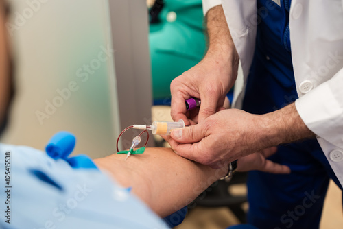 Medical professional administering iv therapy photo