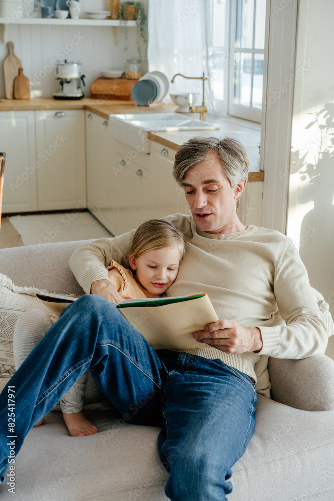Father and daughter reading book Father and daughter reading book