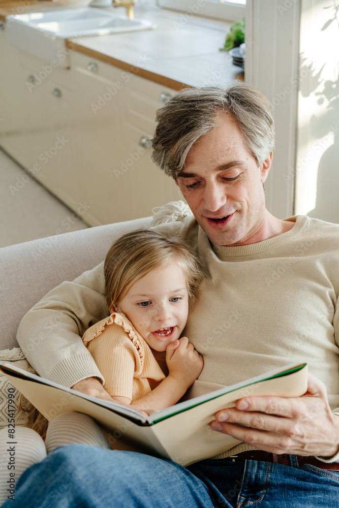 Father and daughter engrossed in storytelling