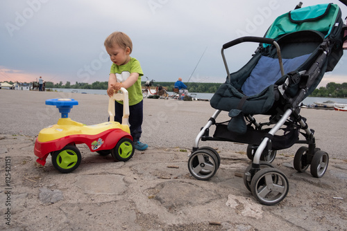 Lttle boy clings to a toy car