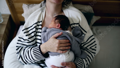 Fotografi Sleeping Mother cradling newborn baby peacefully in bed asleep holding infant on