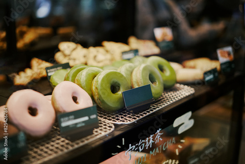 Matcha Green Tea Donuts In A Display Case At A Shop In Uji, Japan.