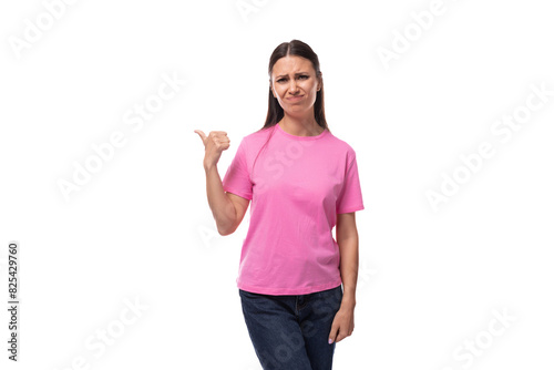 young positive good-looking woman with black hair is wearing a pink t-shirt holding her hand up