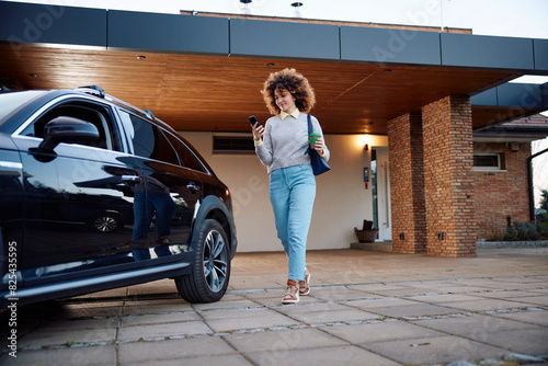 Woman texting as she heads to work