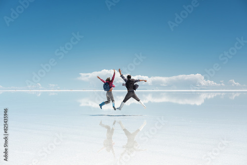travel couple in amazing landscape of uyuni