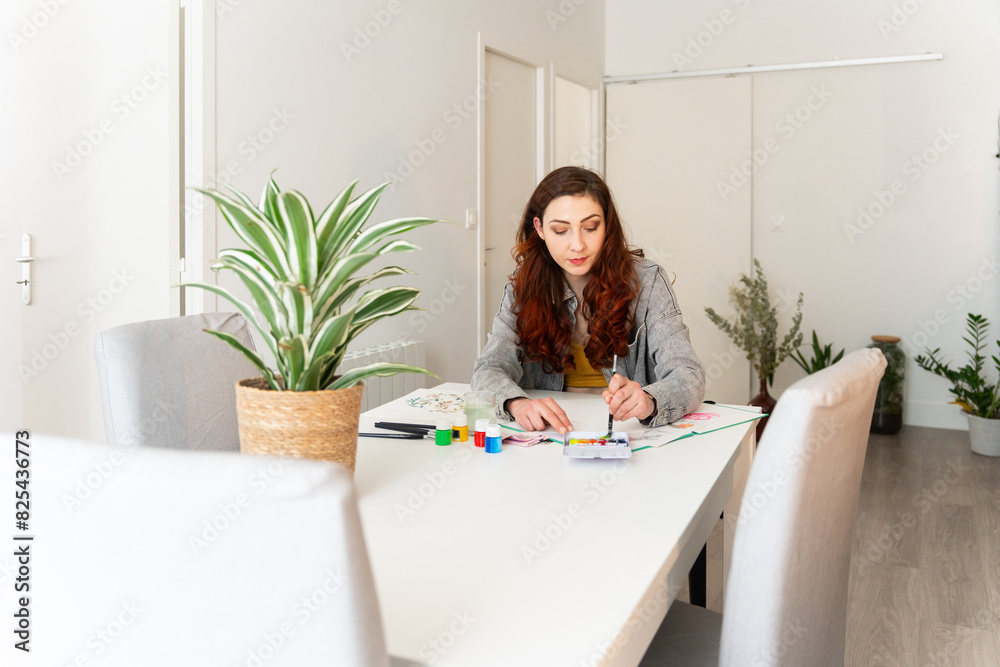 Young Woman Painting A Illustration At Home. Young Woman Painting A Illustration At Home.