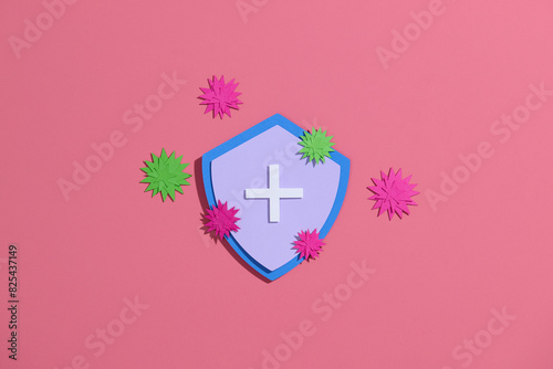 Virus protection banner with shield on pink background