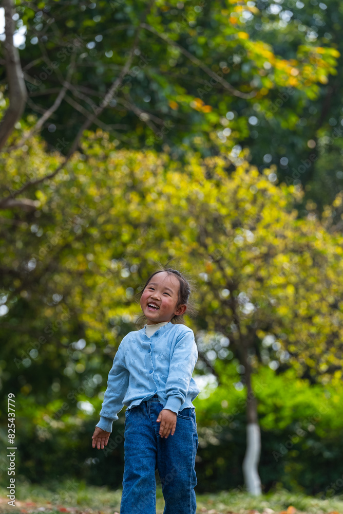 happy little asian girl running in the spring park happy little asian girl running in the spring park
