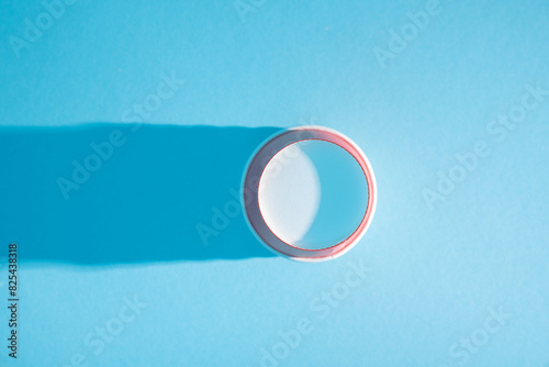 Empty Red Paper Cup on Blue Background photo