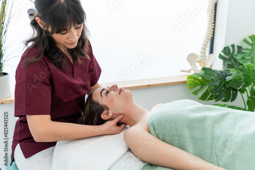 Professional physiotherapist treating patient's neck