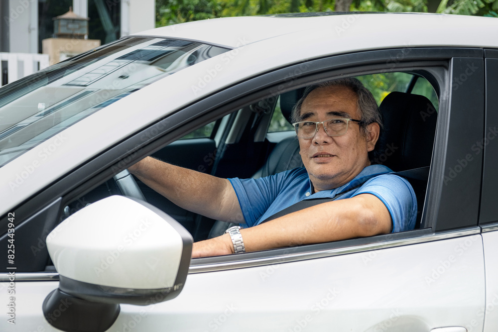 Portrait of an Older man enjoys driving his car Portrait of an Older man enjoys driving his car